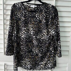 Black, gold and white woman's top